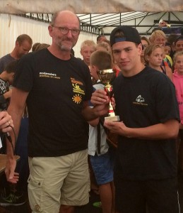 Top scorer Alex Waller lifts the trophy for Enfleld